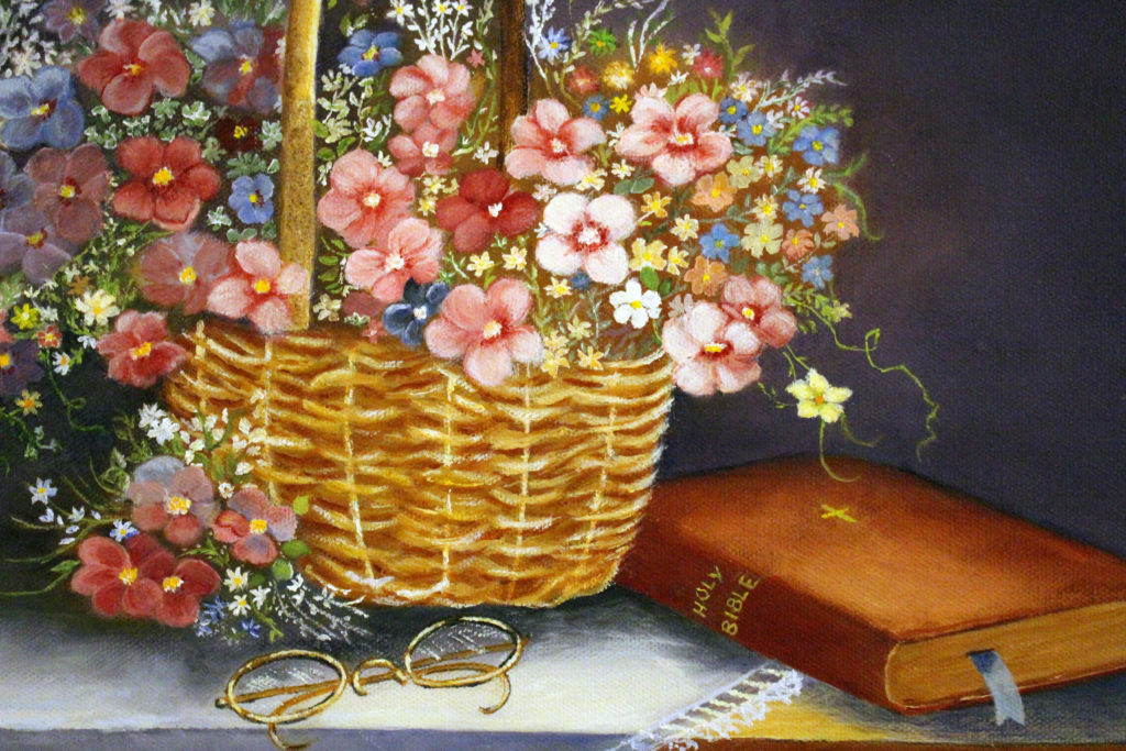 Bible and flower basket painting close up